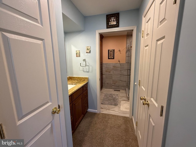 bathroom with vanity and walk in shower