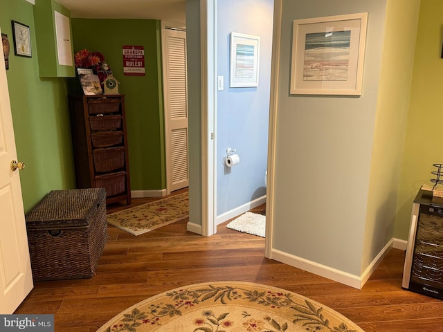 corridor featuring hardwood / wood-style floors