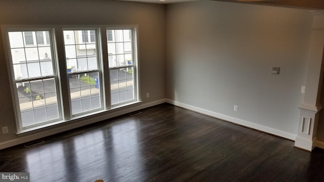 empty room featuring dark hardwood / wood-style floors