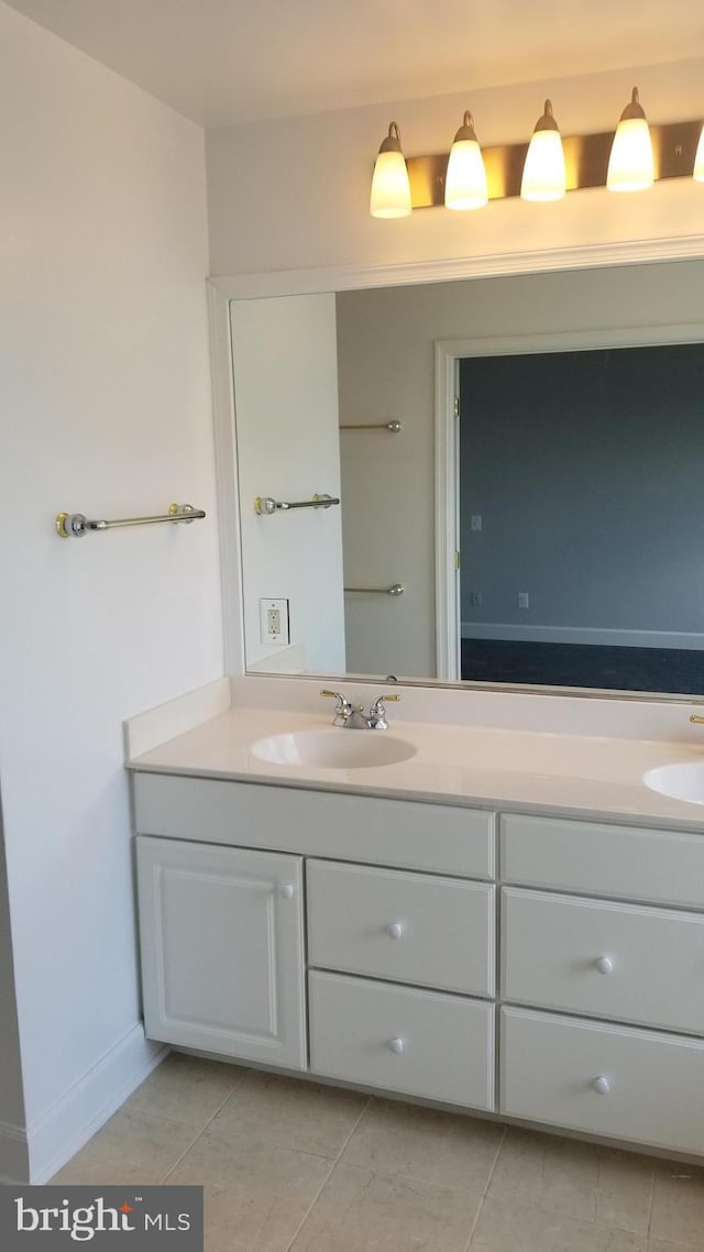 bathroom with vanity and tile patterned flooring