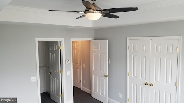 unfurnished bedroom with ceiling fan and ornamental molding