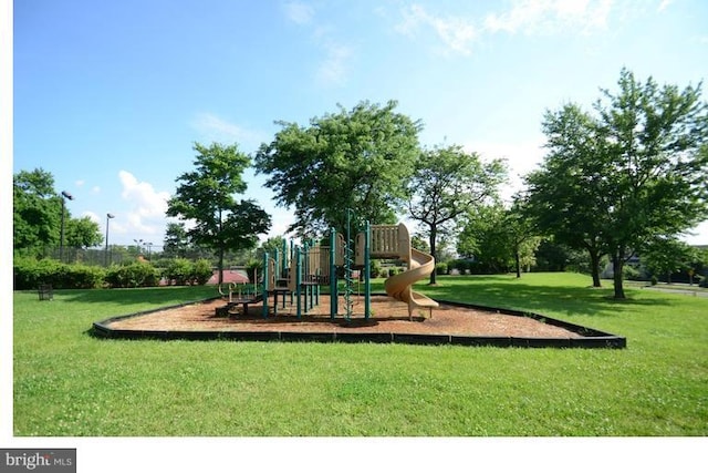 view of play area featuring a lawn