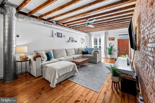 living room featuring wood-type flooring and ceiling fan