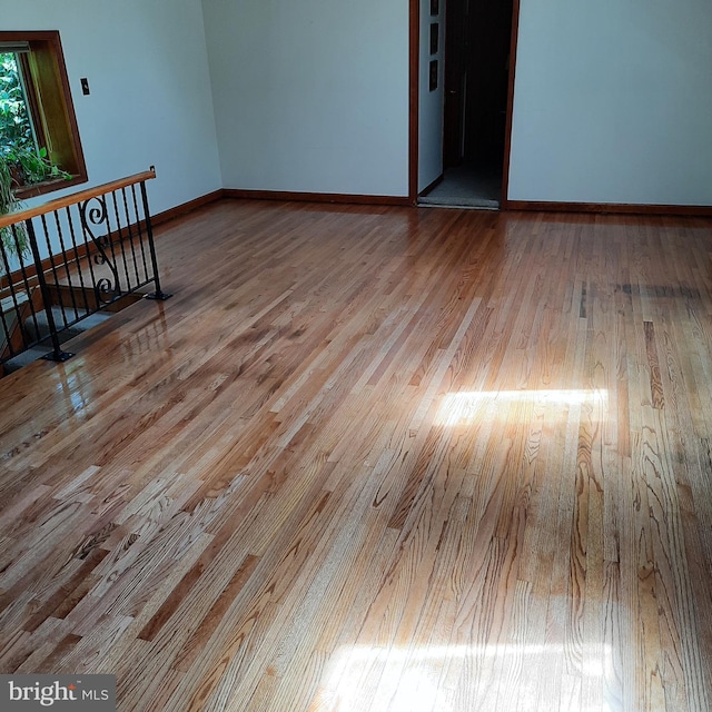 unfurnished room with light hardwood / wood-style flooring