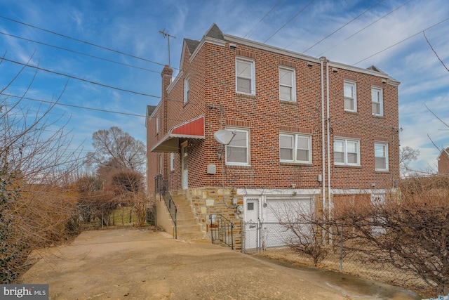 view of side of property featuring a garage