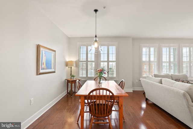 dining space with dark wood-type flooring