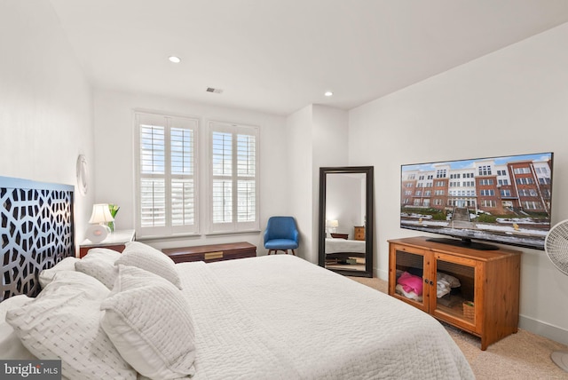 bedroom with light colored carpet