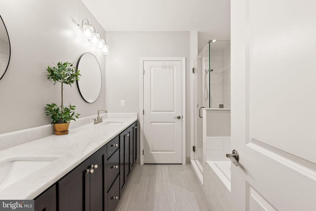 bathroom with vanity and an enclosed shower