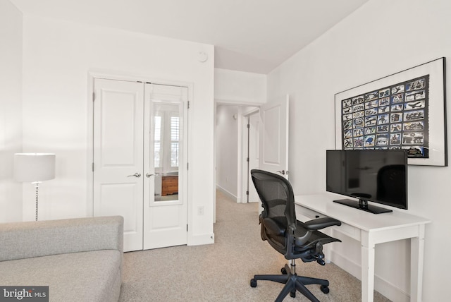 home office featuring light colored carpet