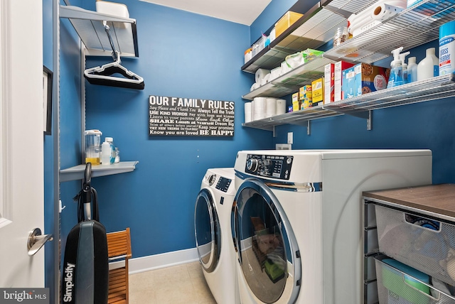 clothes washing area featuring washing machine and clothes dryer