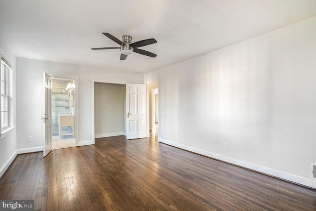 spare room featuring ceiling fan and dark hardwood / wood-style flooring