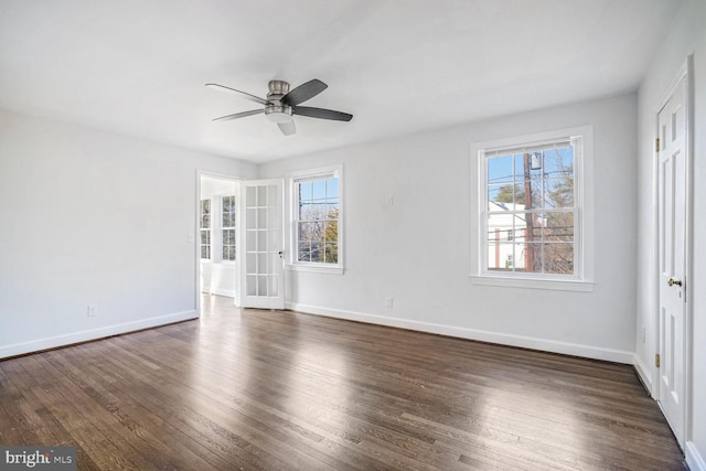 unfurnished room with dark wood-type flooring and ceiling fan