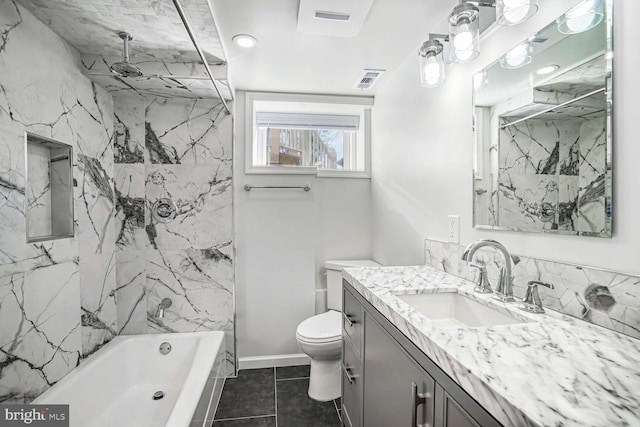 full bathroom with vanity, tile patterned floors, toilet, and tiled shower / bath