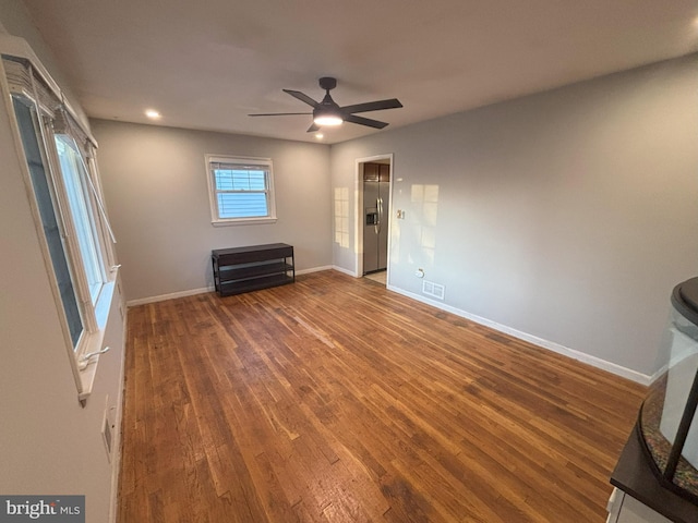 interior space with hardwood / wood-style floors and ceiling fan