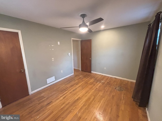 unfurnished bedroom featuring ceiling fan and light hardwood / wood-style flooring