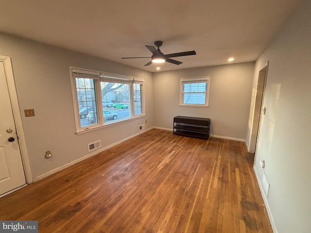 spare room featuring hardwood / wood-style flooring and ceiling fan