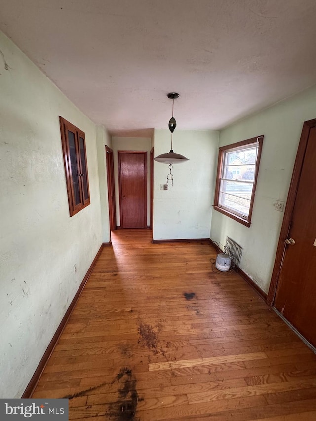 unfurnished dining area with hardwood / wood-style flooring