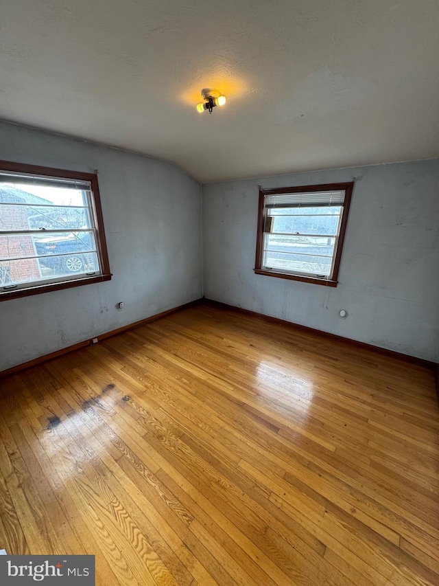 spare room featuring light hardwood / wood-style flooring