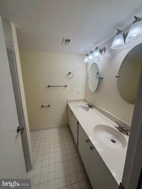 bathroom with vanity and tile patterned flooring