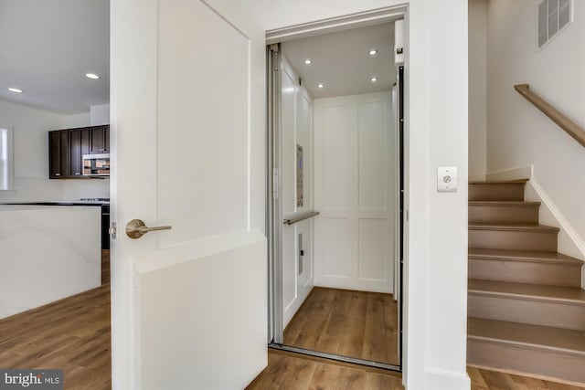 3234 Royal Fern Pl, Rockville, MD 20852 - stairway with visible vents, wood finished floors, and recessed lighting