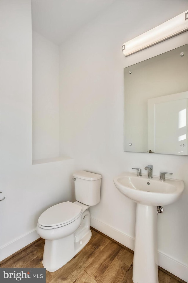 3234 Royal Fern Pl, Rockville, MD 20852 - bathroom featuring toilet, baseboards, and wood finished floors