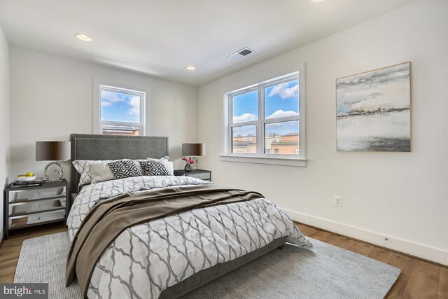 3234 Royal Fern Pl, Rockville, MD 20852 - bedroom with wood finished floors, recessed lighting, baseboards, and visible vents