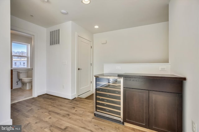 3234 Royal Fern Pl, Rockville, MD 20852 - bar with recessed lighting, baseboards, wine cooler, visible vents, and light wood-style flooring
