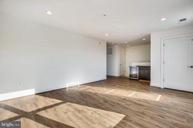 3234 Royal Fern Pl, Rockville, MD 20852 - unfurnished living room featuring baseboards, visible vents, and wood finished floors
