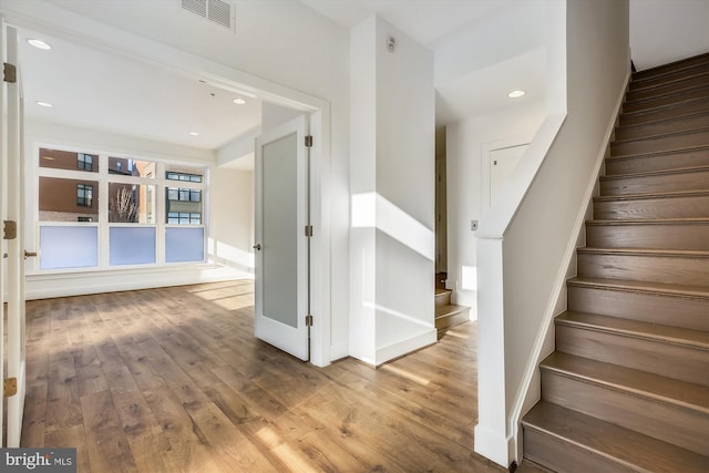 3234 Royal Fern Pl, Rockville, MD 20852 - stairway with baseboards, visible vents, recessed lighting, and hardwood / wood-style flooring