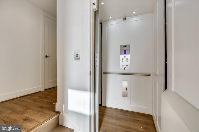 3234 Royal Fern Pl, Rockville, MD 20852 - corridor with elevator, wood finished floors, baseboards, and recessed lighting