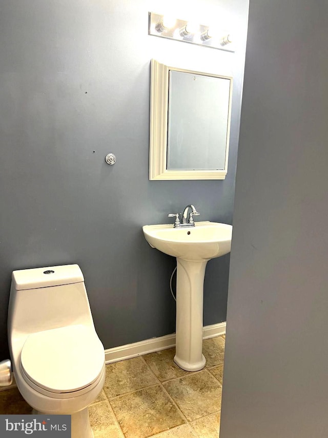 bathroom with toilet and sink