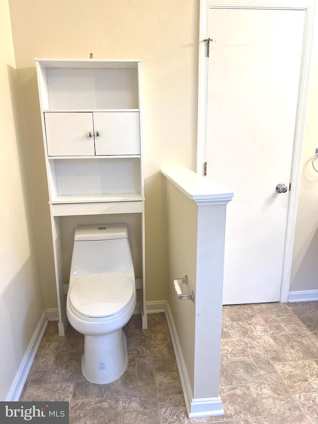 bathroom featuring toilet