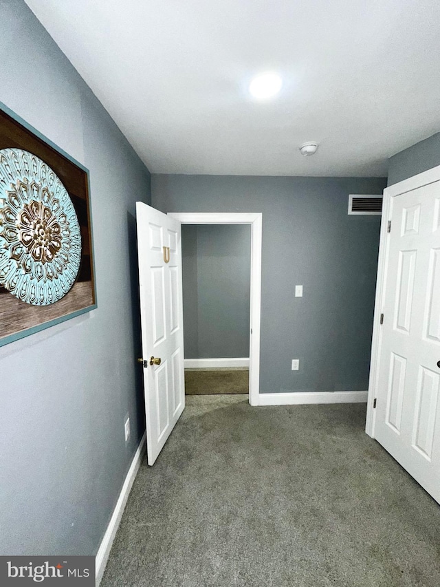 unfurnished bedroom featuring carpet