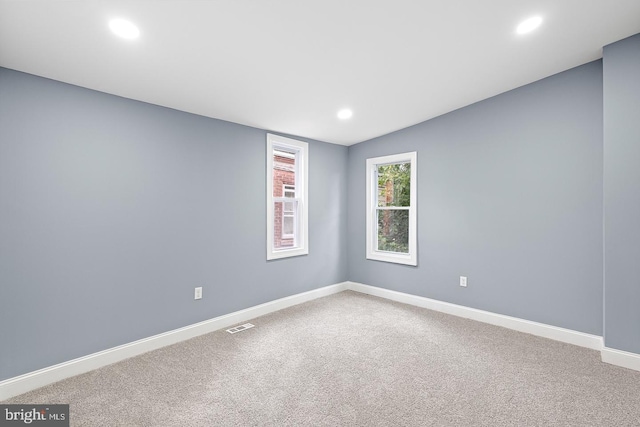 unfurnished room featuring carpet floors