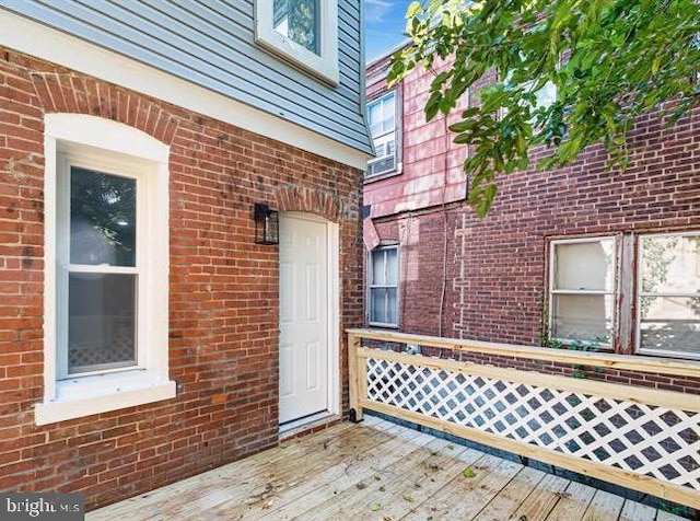 entrance to property with a wooden deck