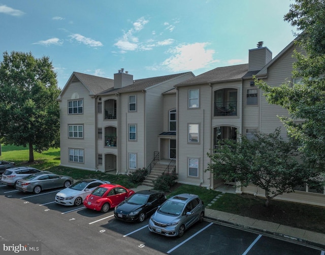 view of property with uncovered parking