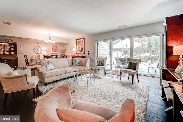 living room with a chandelier and hardwood / wood-style flooring