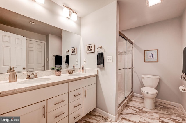 bathroom with toilet, a shower with door, and vanity