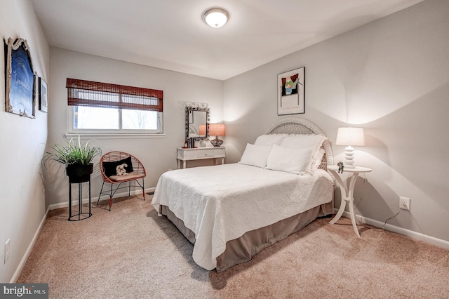 bedroom featuring light colored carpet