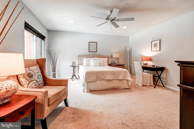 bedroom featuring light carpet and ceiling fan