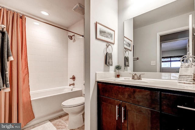 full bathroom featuring toilet, tile patterned flooring, shower / bath combo, and vanity