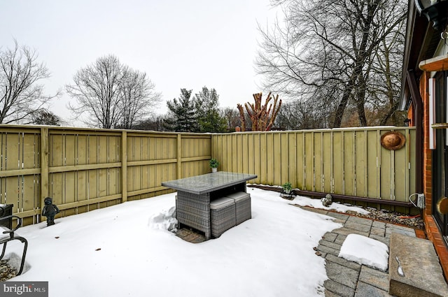 view of snow covered patio