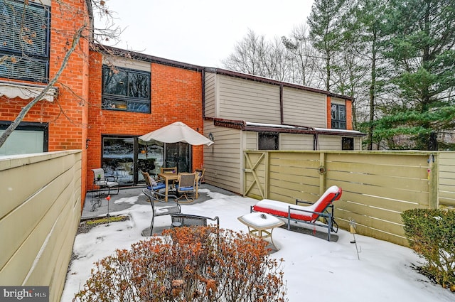 view of snow covered house