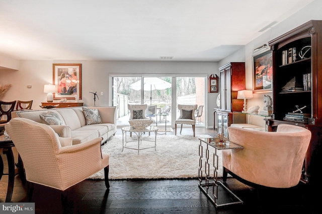 living room with dark hardwood / wood-style flooring