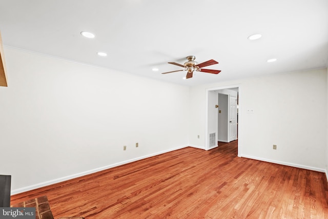 empty room featuring ceiling fan and wood-type flooring