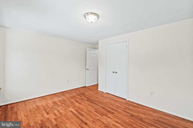 spare room featuring light wood-type flooring