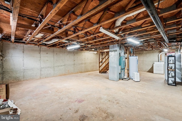 basement with independent washer and dryer and water heater