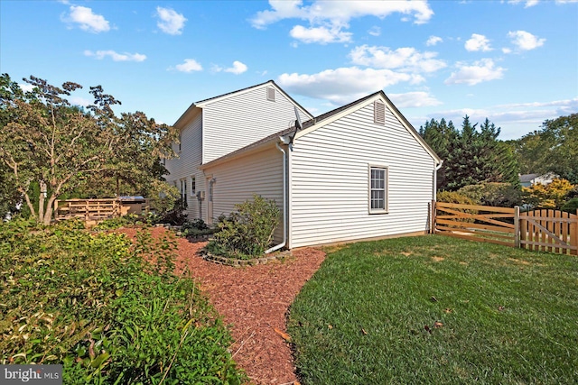 view of home's exterior featuring a yard