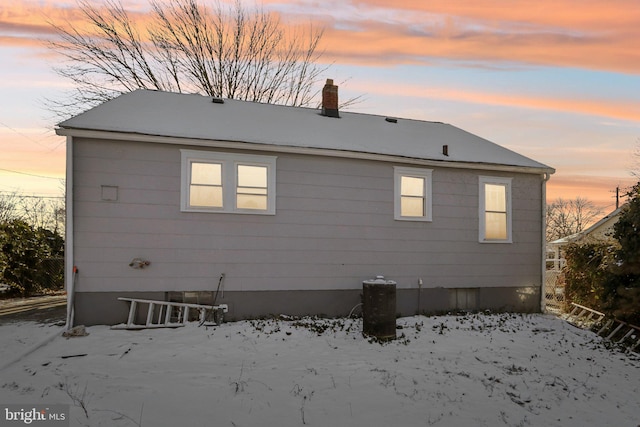 view of snow covered house