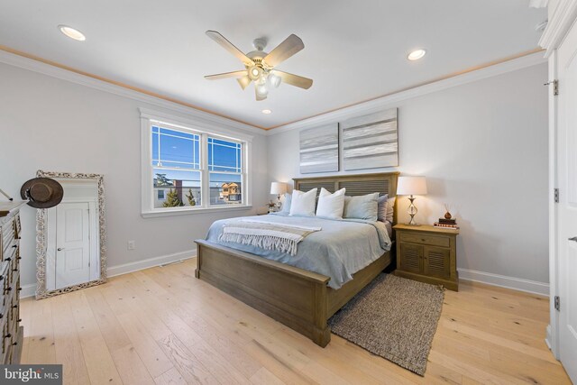 bedroom featuring crown molding, ceiling fan, and light hardwood / wood-style floors